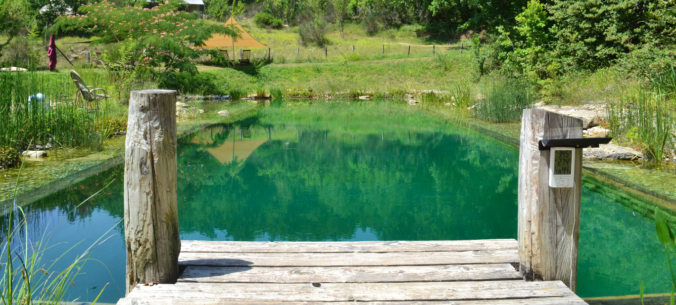 Le Camp's natural swimming pool. Twenty by five metre swimming zone surrounded by a regeneration area. It is a haven for wildlife and an incredible swimming experience. As seen in The Guardian Travel's article “Aquatic bliss: 10 of Europe’s best holiday sites with natural pools”.